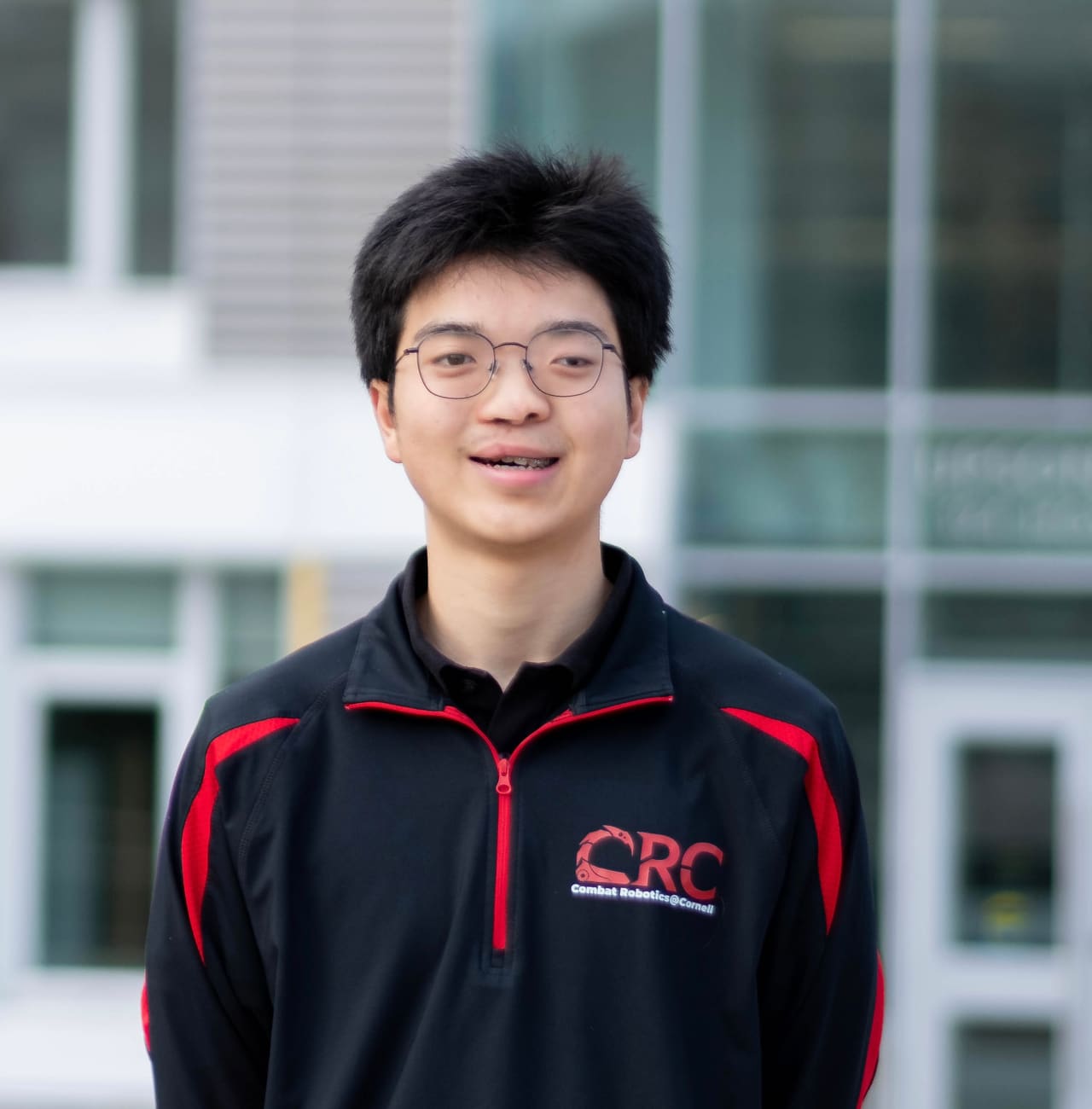 Shao Stassen in a Cornell Combat Robotics quarter-zip.